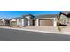 Street view of a single-story house with stone details, landscaping, and a two-car garage at 352 Tigullio Ave, Henderson, NV 89011