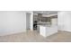 Modern kitchen boasts a large island, gray cabinets, and stainless steel appliances at 352 Tigullio Ave, Henderson, NV 89011
