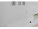 A minimalist laundry room hookup with utility connections on a white wall at 352 Tigullio Ave, Henderson, NV 89011