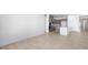 Spacious open living area featuring tile flooring flows into a modern kitchen at 352 Tigullio Ave, Henderson, NV 89011