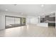 Expansive living space with tile flooring seamlessly connects to the modern kitchen at 352 Tigullio Ave, Henderson, NV 89011