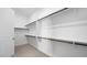 Spacious walk-in closet with multiple shelves and rods for optimal organization and storage at 352 Tigullio Ave, Henderson, NV 89011