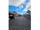 Wide angle shot of parking spots with blue sky and scattered clouds at 4165 Mississippi Ave, Las Vegas, NV 89103