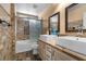 Bathroom with dual sinks and a shower-tub with decorative tile accent and modern fixtures at 10437 Walworth Ave, Las Vegas, NV 89166