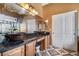 Bathroom with double sink vanity, granite countertop, and decorative mirrors at 10437 Walworth Ave, Las Vegas, NV 89166