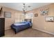 Well-lit bedroom with a cozy bed, chandelier, and a window for natural light and ventilation at 10437 Walworth Ave, Las Vegas, NV 89166