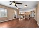 A spacious bonus room area with wood floors, a ceiling fan, and plenty of natural light at 10437 Walworth Ave, Las Vegas, NV 89166