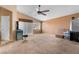 Open concept bonus room featuring a vaulted ceiling, ceiling fan, and lots of natural light at 10437 Walworth Ave, Las Vegas, NV 89166