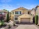 Charming two-story home with a desert-landscaped front yard and a two-car garage at 10437 Walworth Ave, Las Vegas, NV 89166