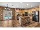 Modern kitchen featuring a center island, stainless steel appliances, and backyard access at 10437 Walworth Ave, Las Vegas, NV 89166