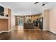 Stylish kitchen with wood flooring, island, stainless steel appliances, and pool access at 10437 Walworth Ave, Las Vegas, NV 89166