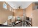 Spacious, well-lit living area with high ceilings, fireplace, and views of the bright dining room at 10437 Walworth Ave, Las Vegas, NV 89166
