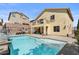 Sparkling backyard pool surrounded by lush landscaping and patio area at 10437 Walworth Ave, Las Vegas, NV 89166