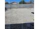 Exterior view of a backyard featuring dirt and a cinderblock fence at 2112 Hollow Oak Ave, North Las Vegas, NV 89031