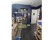Well-lit bedroom with a built-in closet and storage with dark laminated floors throughout the room at 2112 Hollow Oak Ave, North Las Vegas, NV 89031