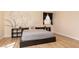 A spacious bedroom with modern decor, vinyl floors, and a large window at 2691 Rimpacific Cir, Las Vegas, NV 89146