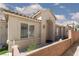 Charming front yard, desert landscaping, and arched entryway to the front door at 2691 Rimpacific Cir, Las Vegas, NV 89146