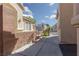 A view of a side yard that includes desert landscaping and block wall at 2691 Rimpacific Cir, Las Vegas, NV 89146