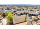 Wide aerial view of the home in a desert community with mountain views at 3665 Cottage Stone Ct, Laughlin, NV 89029
