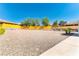 Expansive backyard space featuring gravel landscaping with potential for customization and outdoor enjoyment at 3665 Cottage Stone Ct, Laughlin, NV 89029