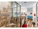 Bathroom featuring tiled shower, soaking tub, and access to the bedroom at 3665 Cottage Stone Ct, Laughlin, NV 89029