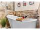 Close-up on bathroom showcasing a standalone tub and decorative tile at 3665 Cottage Stone Ct, Laughlin, NV 89029