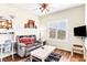 Bright bedroom features a comfortable seating area and natural light from the window at 3665 Cottage Stone Ct, Laughlin, NV 89029