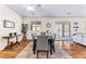 Bright dining area with wood floors, a ceiling fan, and sliding glass door access at 3665 Cottage Stone Ct, Laughlin, NV 89029