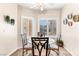 Cozy dining area with decorative wall plates and views of the manicured backyard at 3665 Cottage Stone Ct, Laughlin, NV 89029
