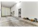Large garage featuring high ceilings, storage, and access to an additional room at 3665 Cottage Stone Ct, Laughlin, NV 89029