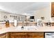Lovely kitchen with a farmhouse sink and stainless steel appliances at 3665 Cottage Stone Ct, Laughlin, NV 89029