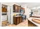 Well-equipped kitchen with wooden cabinets, stainless steel appliances, and adjacent laundry at 3665 Cottage Stone Ct, Laughlin, NV 89029