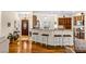 Spacious living room with hardwood floors, breakfast bar, and dark wood cabinetry at 3665 Cottage Stone Ct, Laughlin, NV 89029