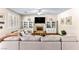 Cozy living room with a fireplace, built-in shelves, plantation shutters and a neutral color palette at 3665 Cottage Stone Ct, Laughlin, NV 89029