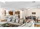 Open concept living space featuring a large sectional sofa, dining table, and a view of the kitchen at 3665 Cottage Stone Ct, Laughlin, NV 89029