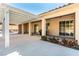 Relaxing covered patio area with stucco columns, offering shade and an inviting outdoor space for entertaining at 3665 Cottage Stone Ct, Laughlin, NV 89029