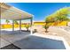 Spacious covered patio area with gravel landscaping and mountain views for relaxing and enjoying the outdoors at 3665 Cottage Stone Ct, Laughlin, NV 89029