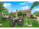 Virtual Staging shows an outdoor dining set and lounge furniture in a beautifully landscaped backyard at 4722 Blue Mesa Way, Las Vegas, NV 89129