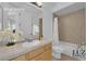Well-lit bathroom with a bathtub-shower combination and a single vanity, providing essential amenities and comfort at 4722 Blue Mesa Way, Las Vegas, NV 89129