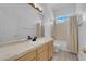 Bathroom featuring a sink with vanity and a shower-tub combo with white shower curtain at 4722 Blue Mesa Way, Las Vegas, NV 89129