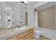 Functional bathroom with a single vanity, tile flooring, and a bathtub-shower combination, offering practicality and style at 4722 Blue Mesa Way, Las Vegas, NV 89129