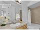 Bathroom with a single sink, a shower-tub combo, tile backsplash, and a large mirror at 4722 Blue Mesa Way, Las Vegas, NV 89129