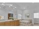 Bright bathroom featuring double sinks, a soaking tub, a large mirror, and natural light from a glass block window at 4722 Blue Mesa Way, Las Vegas, NV 89129