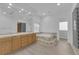 Bathroom featuring a dual sink vanity, large mirror, and a step-up soaking tub at 4722 Blue Mesa Way, Las Vegas, NV 89129