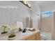 Bright bathroom with a large mirror and vanity with built in cabinets at 4722 Blue Mesa Way, Las Vegas, NV 89129
