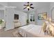 Staged primary bedroom boasts a comfortable bed, neutral color palette, and natural light at 4722 Blue Mesa Way, Las Vegas, NV 89129