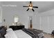 Comfortable bedroom with a ceiling fan, closet, and dresser at 4722 Blue Mesa Way, Las Vegas, NV 89129