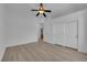 Bedroom features neutral walls, flooring, ceiling fan and closet at 4722 Blue Mesa Way, Las Vegas, NV 89129