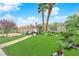 Charming single-story home with well-maintained landscaping, lush green lawn, and three-car garage at 4722 Blue Mesa Way, Las Vegas, NV 89129