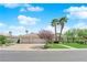 Charming single-story home showcasing a well-manicured lawn, lush greenery, and a three-car garage at 4722 Blue Mesa Way, Las Vegas, NV 89129